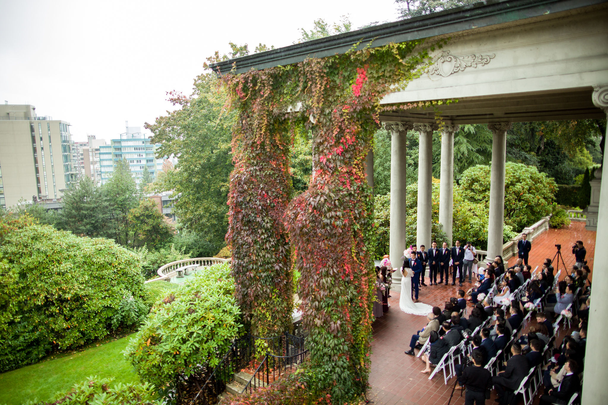 looking out the second floor window of Hycroft Manor while a beautiful wedding ceremony is happening under the canopy